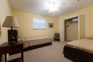 Bedroom with two twin beds and wide closet